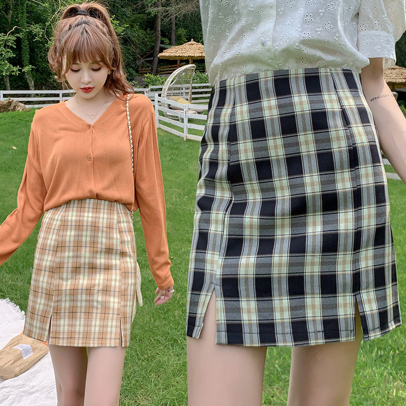 Plaid half-length skirt female short skirt 2021 new pleated skirt Korean version of the student wind high waist pork A letter bag hip skirt